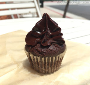 Vegan chocolate cupcake with chocolate frosting at Katie's gluten free bakery.
